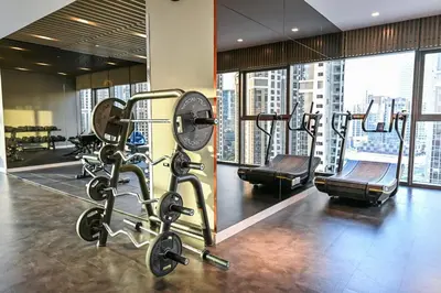 a gym with several tread machines in a building at Luxury 2B Burj Khalifa NYE Views, 5-Star Amenities in Dubai