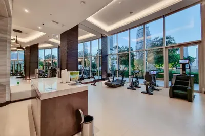 a gym with treadmills and exercise equipment in a building at Unobstructed Burj Fountain View Near Dubai Mall in Dubai