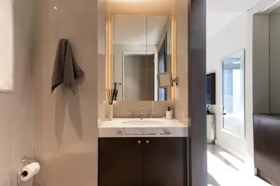 a bathroom with a sink and a mirror at Unobstructed Burj Fountain View Near Dubai Mall in Dubai