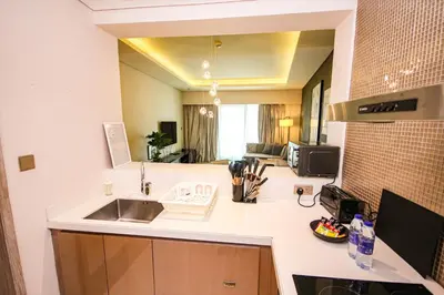 a kitchen with a sink and a counter top at Luxury Fully Furnished 1BHK With Burj Khalifa View at paramount Towers in Dubai