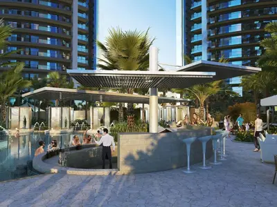 a man standing next to a pool in a resort at Luxury Fully Furnished 1BHK With Burj Khalifa View at paramount Towers in Dubai