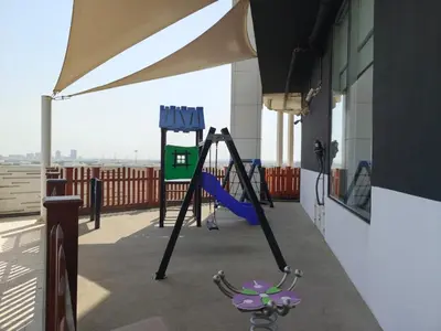 a playground on the roof of a building at Burj View 1BHK near Down Town - Panoramic Balcony View -Pool and Gym in Dubai