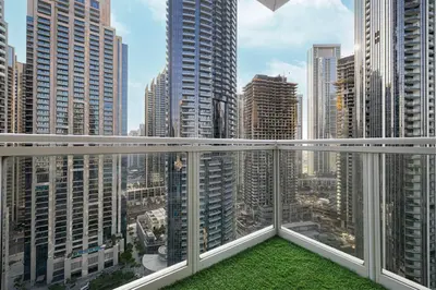 a balcony with a view of a city at Restay Homes at The Residences Tower 1 - Full Burj Views from all apartments in Dubai