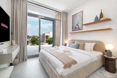 a bedroom with a large bed and a large window at Upscale 4BR Villa, Bali Pool, Resort Escape in Dubai