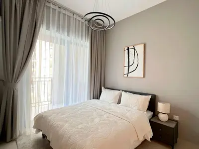 a bedroom with a bed and a large window at Stylish 1BR in Zada Tower near Business Bay Metro in Dubai