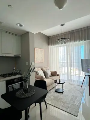 a living room with a couch and a table at Stylish 1BR in Zada Tower near Business Bay Metro in Dubai