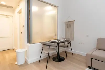 a small table in a living room with a couch at Luxury Upgraded Palm Studio with Marina and Yacht Views in Dubai