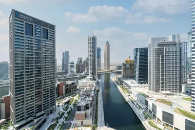 a view of a river in a city with tall buildings at Modern Studio in Peninsula One with Canal Views in Dubai