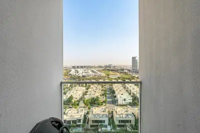 a view of a city from a window in a building at Modern 1Bed near Parks and Famous Golf Clubs in Dubai