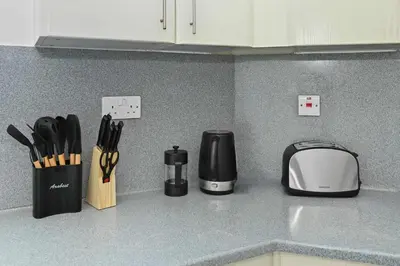 a kitchen counter with a toaster and a toaster at Spacious modern 2 Bed and Maids I Sleeps 7 in Dubai
