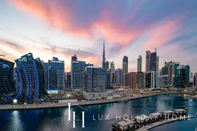a view of a city skyline with a river at LUX The 15 Northside Burj Khalifa View Suite in Dubai