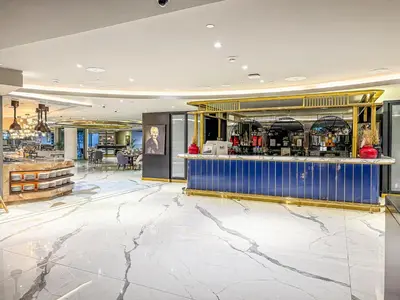 a bar in a hotel lobby with a marble floor at Savis Homes - Stylish 1BR in Business Bay with Burj Khalifa View in Damac Paramount Tower in Dubai