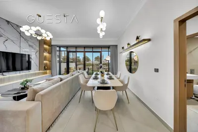 a living room with a couch and a table at Vida Residences The Hills, Dubai in Dubai