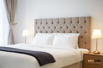 a bedroom with a large bed with white sheets and pillows at Splendour Living 1BR at Azizi Riviera in Dubai