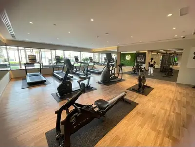 a gym with treadmills and cardio equipment in a building at FIRST CLASS 1BR Stylish , Modern Comfort in Dubai
