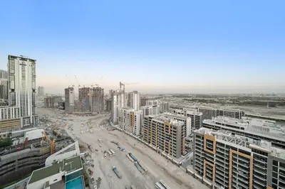an aerial view of a city with tall buildings at FIRST CLASS 2BR Luxury Living at Waves Grande in Dubai