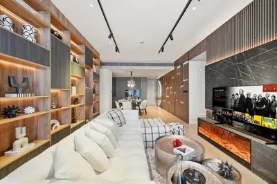 a living room with a white couch and a tv at Prestigious 2BD Seaside Apartment, The Address JBR in Dubai