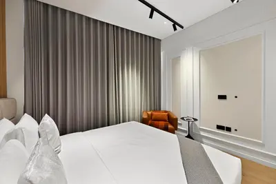 a hotel room with a bed and a chair at Prestigious 2BD Seaside Apartment, The Address JBR in Dubai