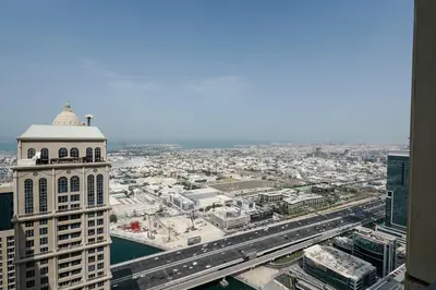 an aerial view of a city with a building at Premium 3-BR Serene Canal View High Floor in Dubai