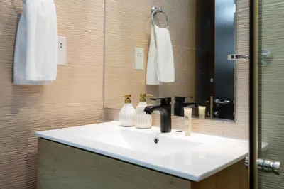 a bathroom with a white sink and a mirror at Peaceful - Charming - Urban Hideaway in Dubai
