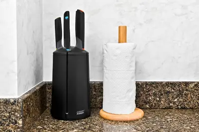 a black vase and a roll of toilet paper on a counter at Torch Dubai Marina 2BDR with Pool Gym and Views in Dubai