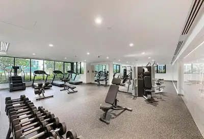 a gym with treadmills and exercise equipment in a building at Luxury 1BR in Central Business Bay in Dubai