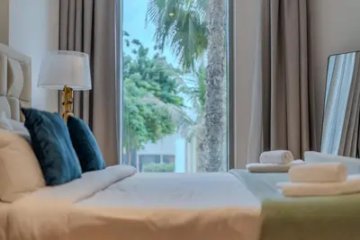 a bedroom with a bed and a large window at TRPS - Bluewaters Residence 3, Bluewaters Island - Ain Dubai View, Fully Furnished, Close to JBR and Marina in Dubai