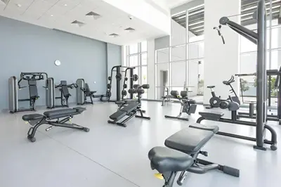 a gym with several treadmills and cardio machines at TRPS - Bluewaters Residence 3, Bluewaters Island - Ain Dubai View, Fully Furnished, Close to JBR and Marina in Dubai