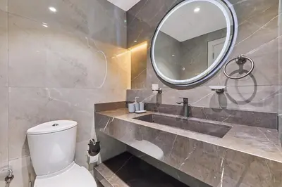 a bathroom with a sink and a mirror at Luxury 1BHK with Stunning Canal View Business Bay in Dubai