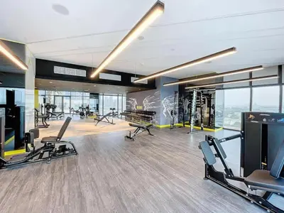 a gym with treadmills and exercise equipment in a building at Elegant 2BR Apartment Heart of Business Bay High Floor in Dubai