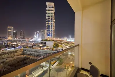 a view of a city at night from a building at Khalifa View Luxe 1BHK in Dubai