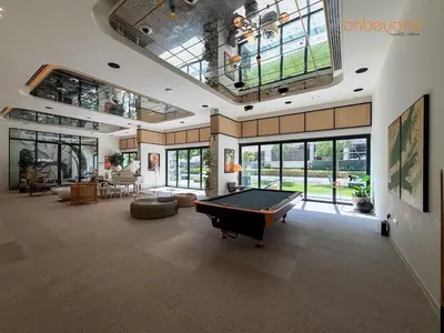 a large living room with a pool table in it at Nomad Haven with Pvt Cinema and C0-working Space in Dubai