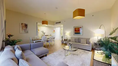 a living room with couches and a dining room at Vacationer I Luxury 2 Bedroom Apartment I Marina View I Steps from JBR Beach in Dubai