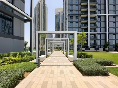 a walkway in a city with tall buildings at Vacationer l Stunning 1 Bedroom l City View l Pool, Gym Access in Dubai
