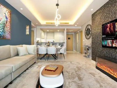 a living room with a couch and a tv at ElysianSky Burj Khalifa Views 3 Bedroom Apartment at Paramount Hotel Midtown with 64th Floor Rooftop Pool in Dubai