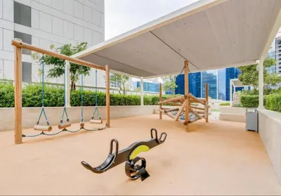 a gym with swings and a canopy in a building at Modern 1BR Near Burj Khalifa Business Bay Reva Apt in Dubai