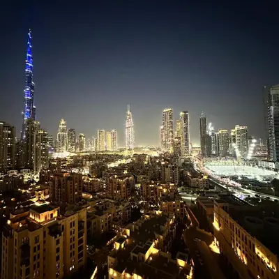 a view of a city at night with at Bellevue Towers Luxurious Burj Khalifa, Full Downtown & Old-town Views in Dubai