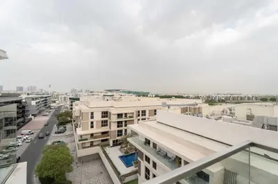 an aerial view of a city with buildings and cars at Elegant 3BR & City Skyline View Azizi Greenfield in Dubai