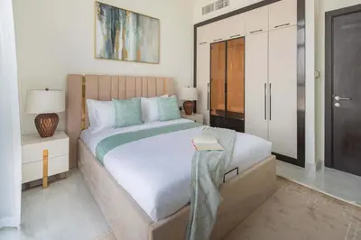 a bedroom with a large bed and a closet at Frank Porter - GEMZ by Danube, Al Furjan in Dubai