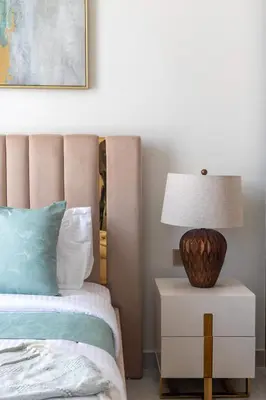 a bedroom with a bed and a lamp on a nightstand at Frank Porter - GEMZ by Danube, Al Furjan in Dubai
