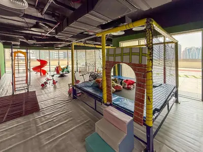 a room with a play room with a playground at Frank Porter - Hera Tower in Dubai