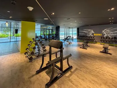 a gym with treadmills and ellipticals in a building at Frank Porter - Aykon City Tower C in Dubai