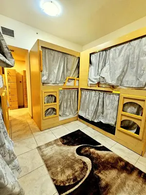 a small room with a large rug in a room at PHOENIXWAVES VACATIONAL HOMEs in Dubai