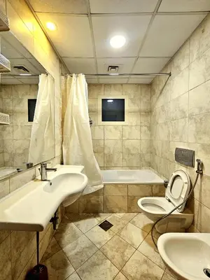 a bathroom with a sink and a toilet and a tub at PHOENIXWAVES VACATIONAL HOMEs in Dubai