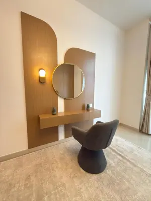 a chair in a room with a mirror at Duja Tower in Dubai
