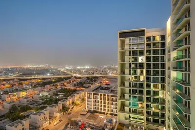 an aerial view of a city with a tall building at FIRST CLASS Studio Cozy Luxury Escape in Dubai