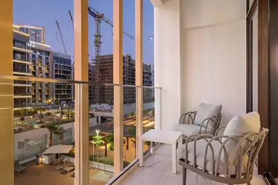 a balcony with a view of a city at FIRST CLASS Studio Luxury Comfort , Pool View in Dubai