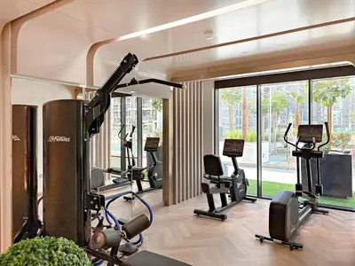 a gym with several exercise bikes in a room at FIRST CLASS Studio Luxury Comfort , Pool View in Dubai
