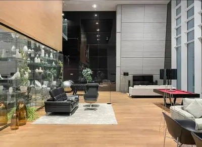 a lobby with couches and chairs in a building at Index Tower DIFC with Burj Khalifa View Chic 1 BR in Dubai