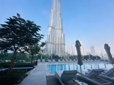 a swimming pool with a view of a tall building at Seraya Residences at Address Opera Dubai in Dubai